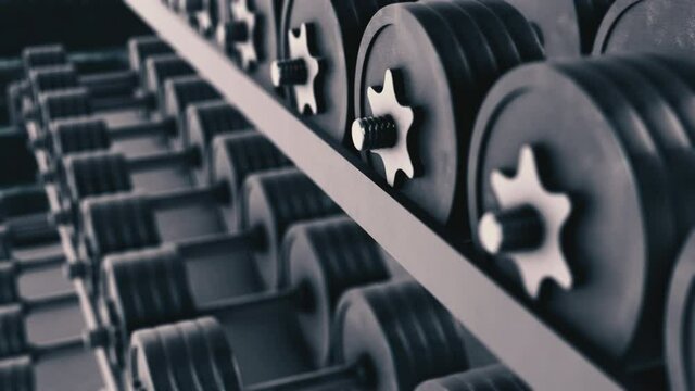 close-up of a rack with dumbbells, concept of fitness and getting stronger (3d render)