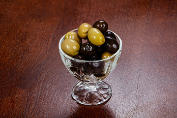 Green and black olives in the bowl
