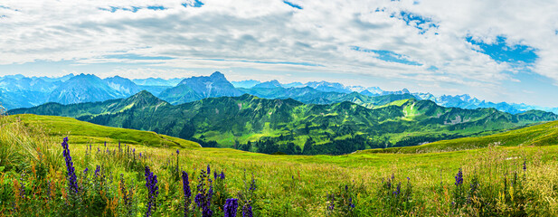 Trekking in European Alps, Kleinwalsertal, Vorarlberg, Austria. View from the plateau of mountain Hoher Ifen (2230m) southwards over Algau Alps, on the left mountain Grosser Widderstein (2533m)