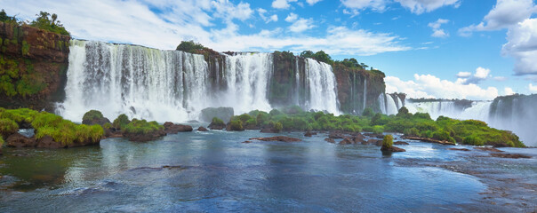 Iguazu waterfalls in Argentina, view from above. Panoramic view of many majestic powerful water...