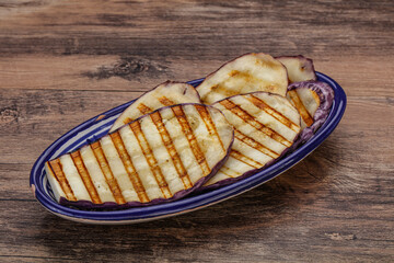 Grilled graffiti eggpant slices with oil