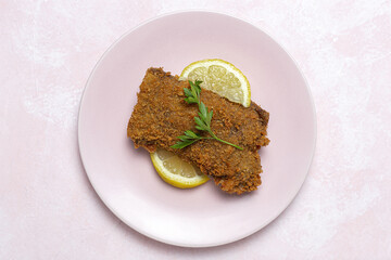 Homemade traditional Milanese veal escalope with french fries