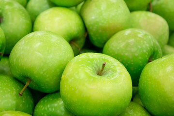 Photo on the theme of fruit. Boxes of juicy apples in the supermarket.