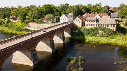 Fototapeta na wymiar Long brick bridge, Kuldiga, Latvia. Captured from above.