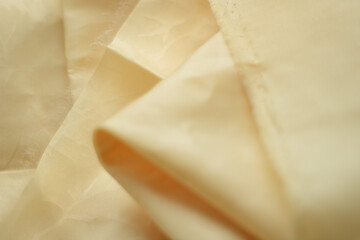 pieces of yellow fabric for sewing. cut fabric. space for text