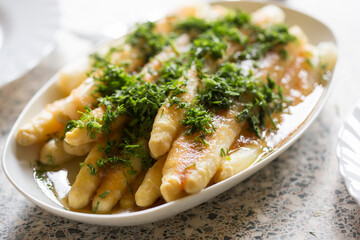 White asparagus with breadcrumbs in melted butter and dill - 434601942