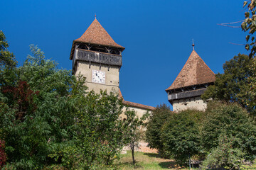 Fototapeta na wymiar Fortified church from Alma Vii village, Moșna commune, Sibiu county, September 2020,The clock tower