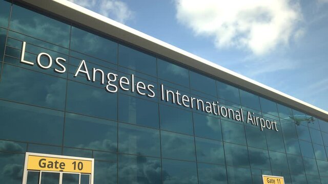 Airliner take off reflecting in the windows with Los Angeles International Airport text