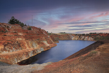 Pond with contaminated waters of an old copper mine. environmental hazard