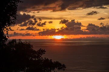Naklejka na ściany i meble View of sunset on the Pacific coast of Manuel Antonio
