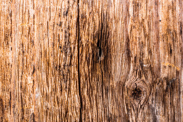Old wooden wall with cracks and knots. View close up