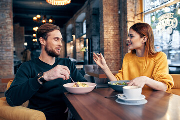 cheerful young couple communication restaurant leisure lifestyle