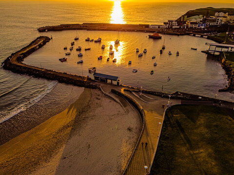 Drone aerial photo, Portrush Harbour sunset, Causeway coast and Glens, County Antrim, Northern Ireland