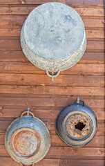 old antique, containers hanging on a rustic wooden wall