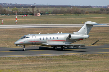 Private business jet taxiing on a runway