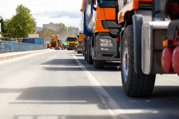 Trucks parked on the street and ready to transport construction materials - 434616984