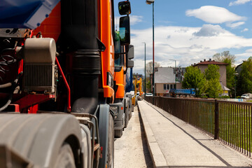 Trucks parked on the street and ready to transport construction materials - 434617180