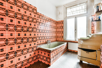 Interior of old fashioned bathroom with bathtub and walls decorated with colorful mosaic tiles in...