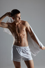 Fototapeta premium sporty man with muscular torso white towel