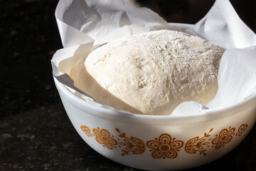 Sourdough dough rising after being kneaded to make a loaf of bread