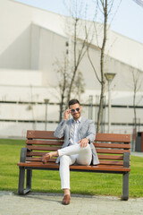 Fototapeta premium Businessman is sitting and smiling