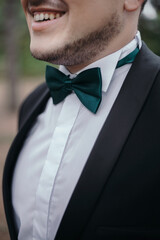 Elegant young man in jacket. Fashion model. Portrait of a young man in a jacket