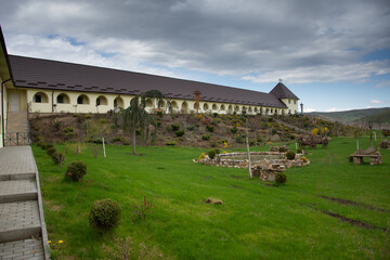 Fototapeta na wymiar Dumbrava Monastery, Alba, ROMANIA, 2021, lake in the monastery courtyard