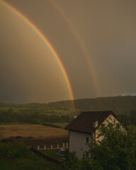 Rainbow in the sky over the rural regia in the western Serbia
