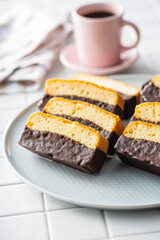 Sliced sponge dessert. Sweet sponge cake with chocolate