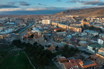 Scenic aerial view of old town of georgian city of Gori at spring