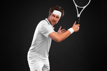Tennis player with racket in white costume. Man athlete playing isolated on light background.
