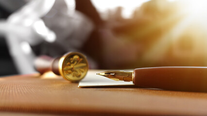 Old retro pen dipped in special ink. Concept of writing a letter, invitation in the past and...