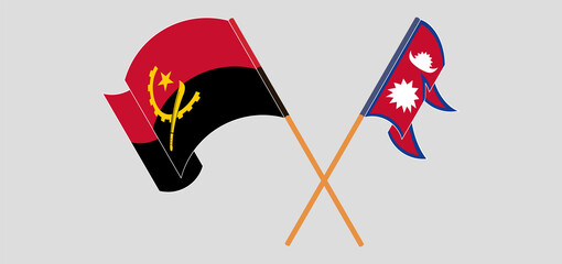 Crossed and waving flags of Angola and Nepal