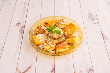 Delicious Galician dessert of flambé pancake with ice cream
