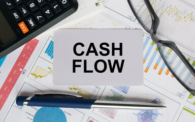 Business card with text Cash Flow with, glasses, pen and calculator