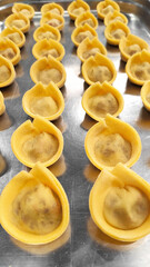 yellow dumplings on the dish. Flat lay top-down