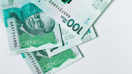 colombian money, one hundred thousand pesos on white background