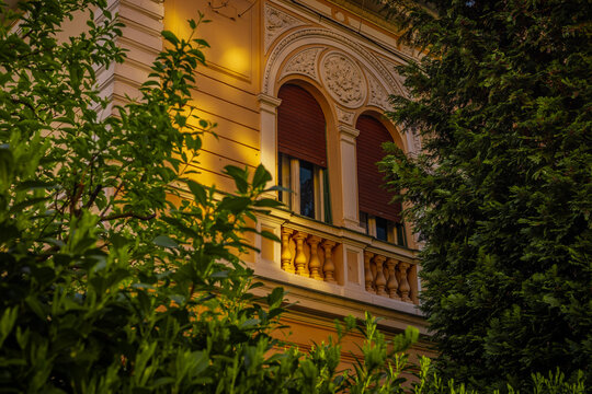 Window bifora on an old upper class house hiding between the trees