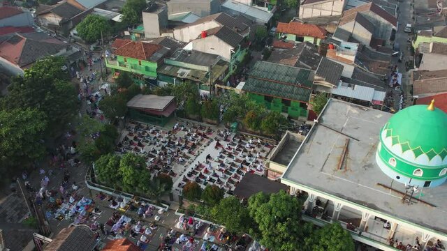 Aerial View of People offering prayers on the Eid morning at famous mosque Jama Masjid in Bekasi. Bekasi, Indonesia, May 19, 2021