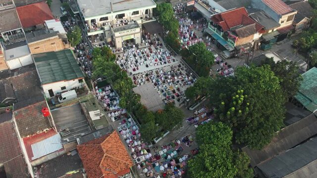 Aerial View of People offering prayers on the Eid morning at famous mosque Jama Masjid in Bekasi. Bekasi, Indonesia, May 19, 2021