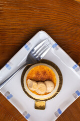 Creme brulee mini cheesecake tart on small plate