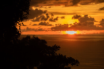 Naklejka na ściany i meble View of sunset on the Pacific coast of Manuel Antonio