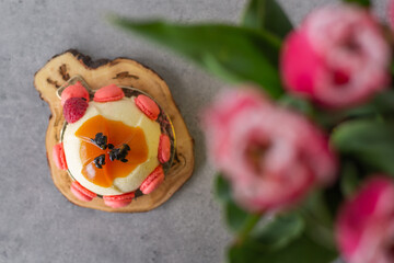 Mini passionfruit mousse cake with tiny macaron decorations