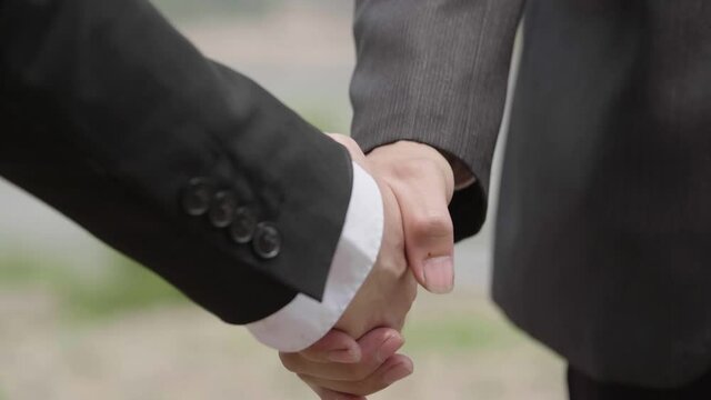 Businessman Shaking Hand With Business Partner, Slow Motion
