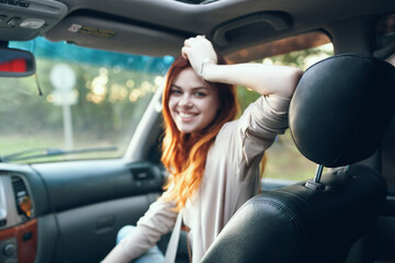 woman travel companion in car salon portrait open window emotions model