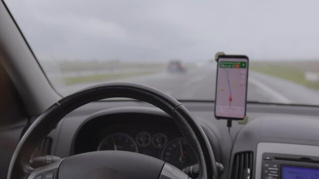 Video, woman hands drive a car, fingers lie on the steering wheel, beautiful fingers female hands