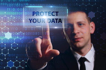 Business, Technology, Internet and network concept. Young businessman working on a virtual screen of the future and sees the inscription: Protect your data
