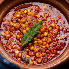 Red corn esquites on wooden background. Mexican food