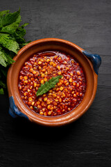 Red corn esquites on dark background. Mexican food