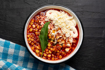 Red corn esquites on dark background. Mexican food